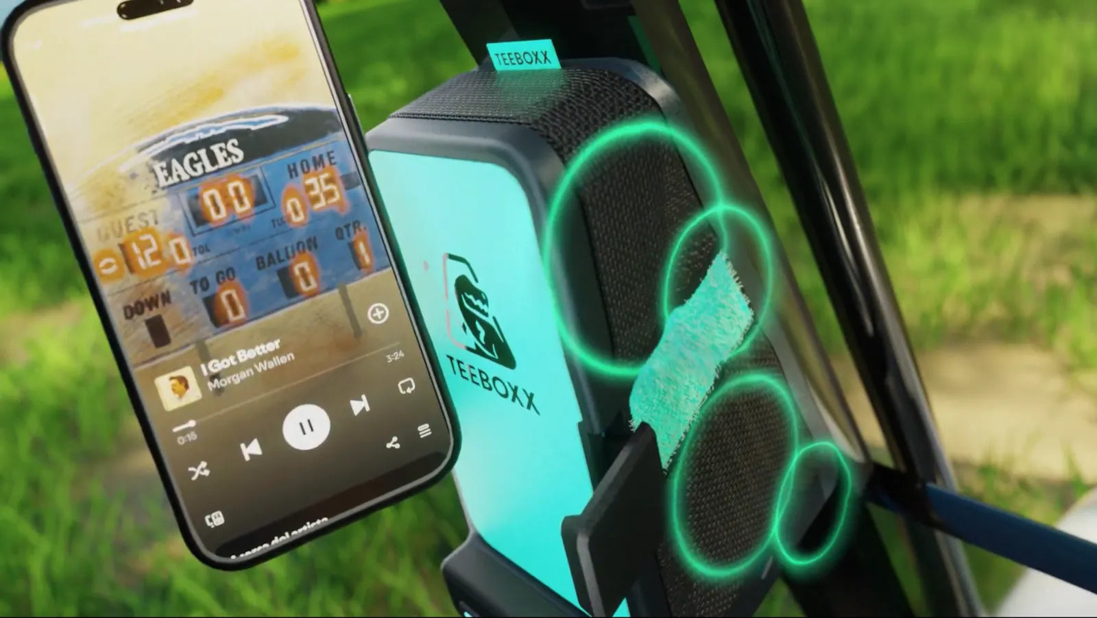 Phone showing a game score next to a TeeBoxx speaker with glowing sound rings